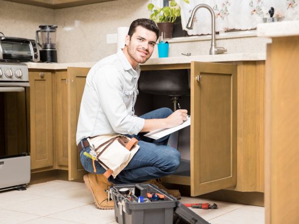 Two men standing and talking near an elevator inside a building in Istanbul.